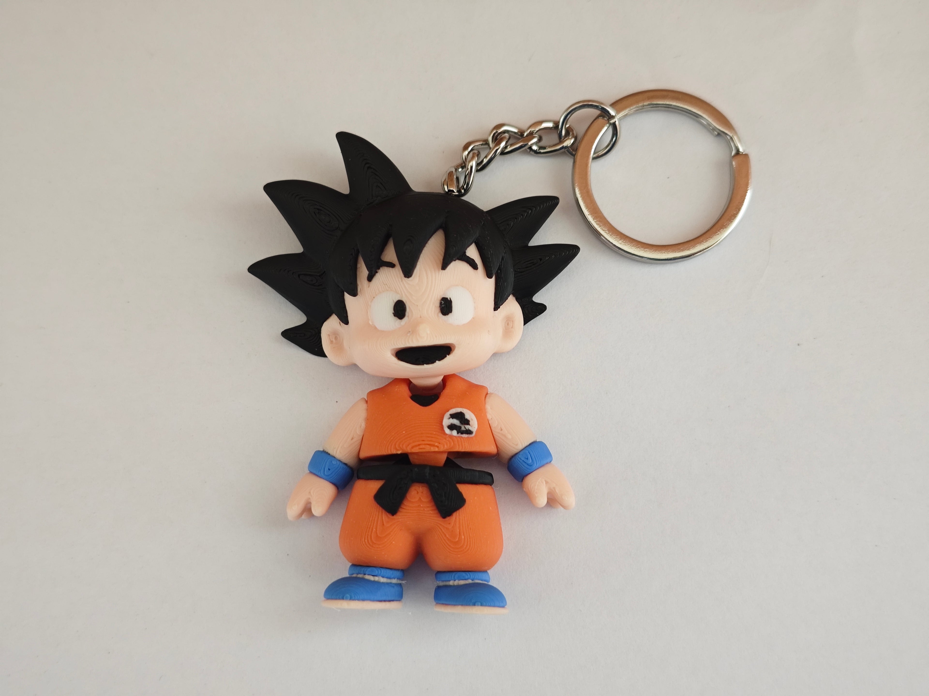 🔑 Llaveros Mini Flexi de Goku – Poder y Aventura en tu Llavero